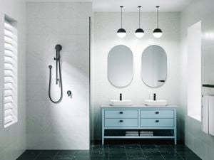 Matte black Showerhead with black accessories and lighting to go with a blue basin. 