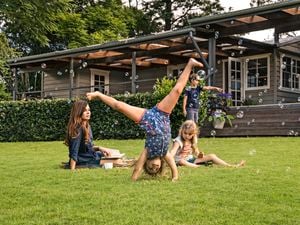 Kids playing on lawn, blowing bubbles, doing cartwheels