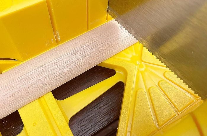Circular saw cutting pine panels
