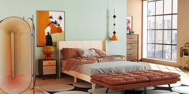 A modern furnished bedroom with a bed, side unit. rug on floor, print on the wall and a window in it.
