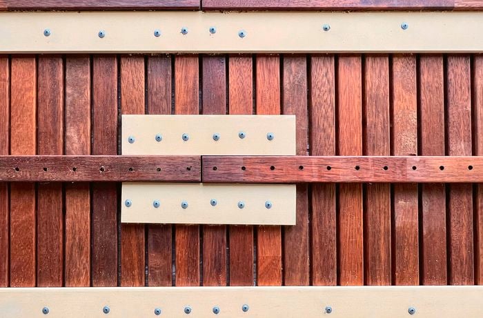 Wooden slatted panel with lid supports screwed inside the stiles.