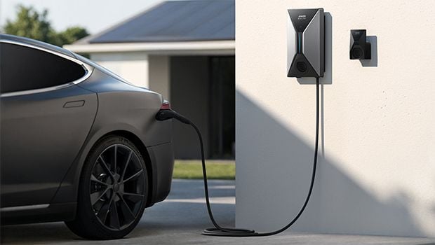 an electric car charging with a battery mounted on the wall