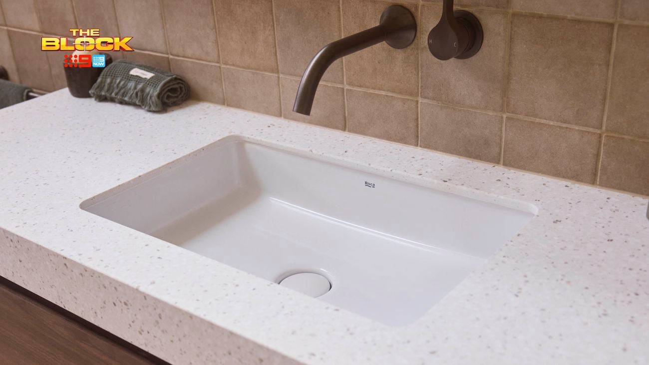 White marble rectangle basin on timber vanity