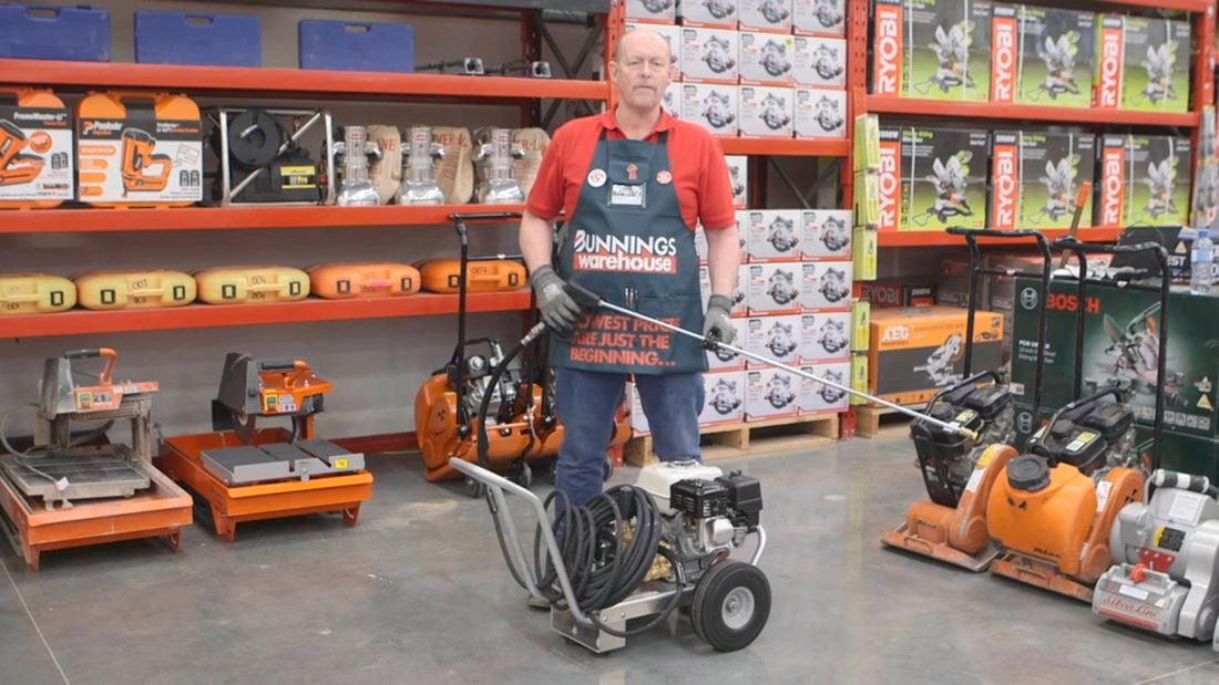 Bunnings team member holding a water blaster