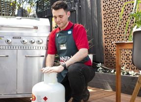 A Bunnings Team Member with a gas bottle