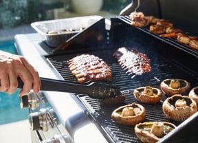 Outdoor BBQ, cooking mushroom an meat.