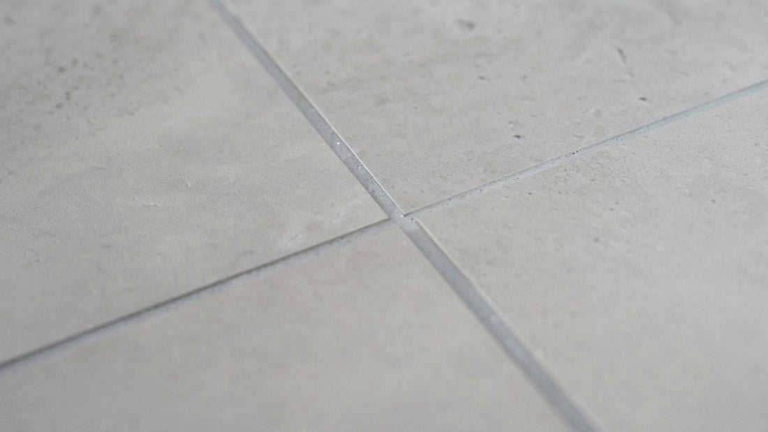 Sealed grout tiled floor with light-colored grout lines 