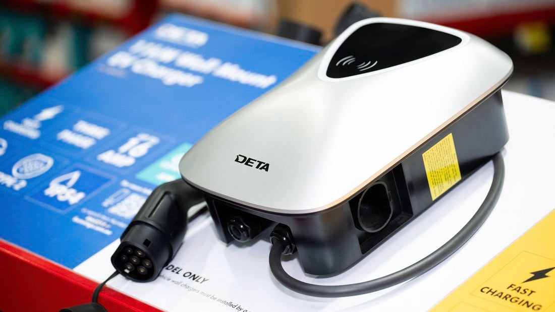 The image shows a DETA 11kW Wall Mount EV Charger, featuring a sleek silver design and a Type 2 connector, highlighted for its fast charging capabilities and IP54 rating. 
