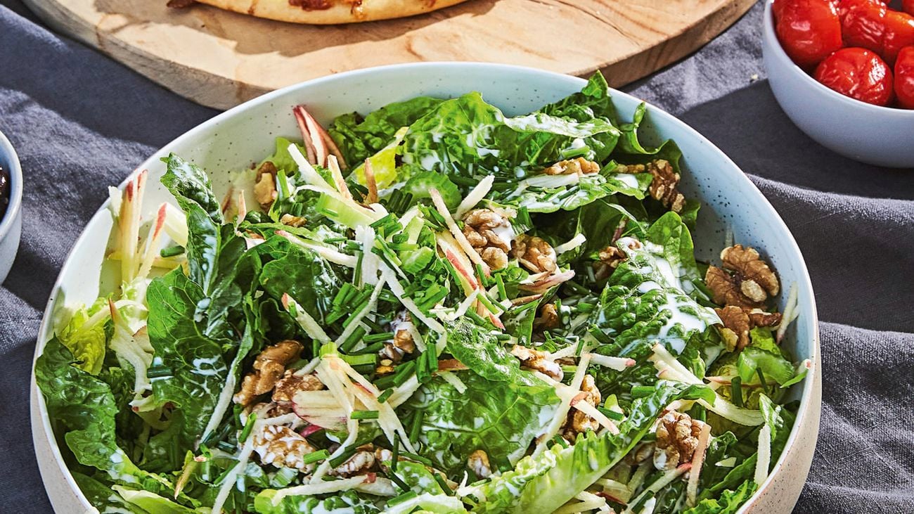 Cos and walnut salad in a serving bowl
