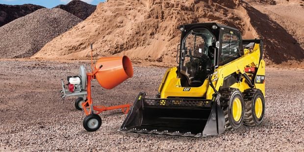 cement mixer and digger on construction site