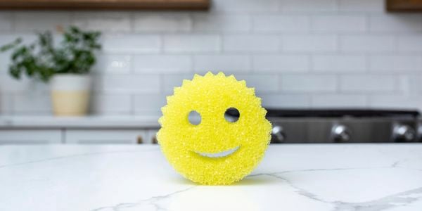 Close up of the Scrub Daddy sponge on a kitchen benchtop.