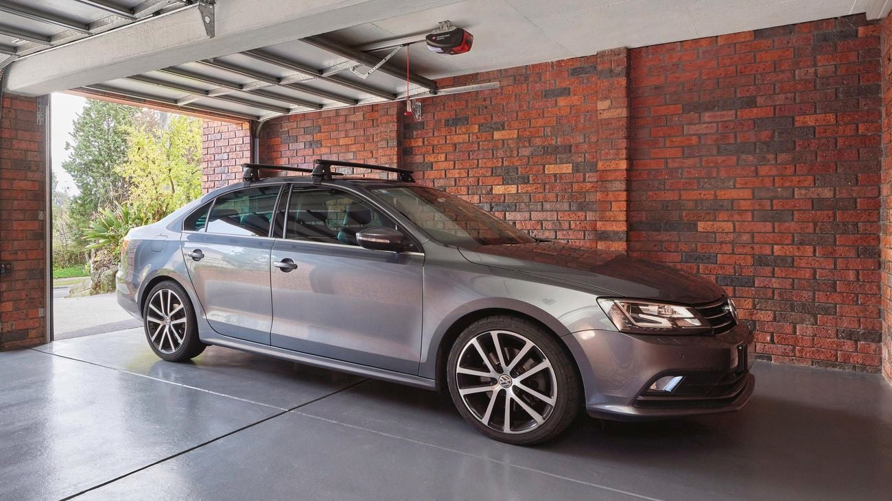 New garage floor with car parked inside.