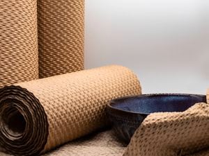 Paper bubble wrap rolls and a blue bowl.