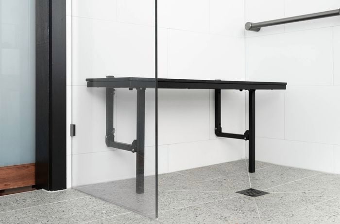 Shower layout with supportive shower chair makes it easier and less tiring to bathe