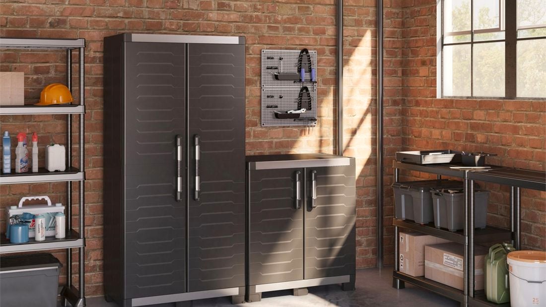 brick wall with shelving and black storage cabinets