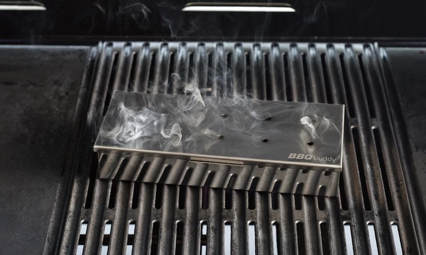 Barbecue accessory sitting on a lit barbecue