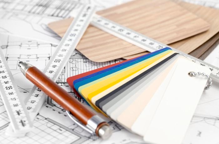 Close up of a ruler, pencil and assortment of colour swatches