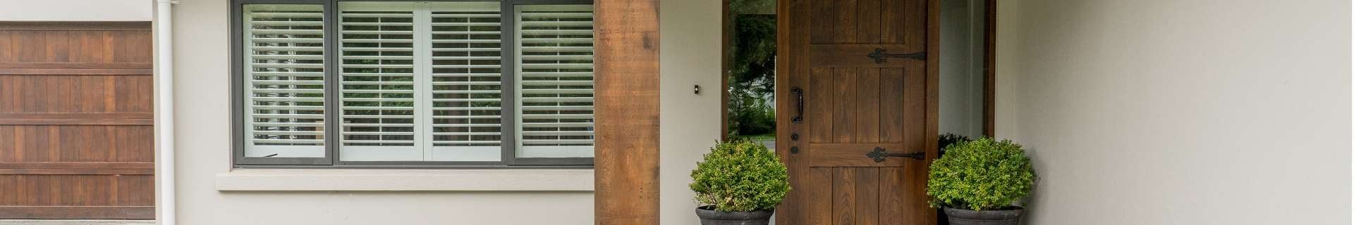 Front of house with timber front door
