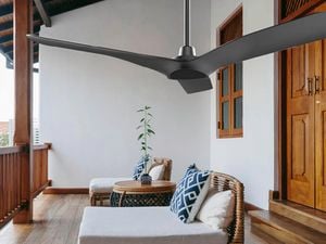 Outdoor balcony with fan and outdoor furniture.