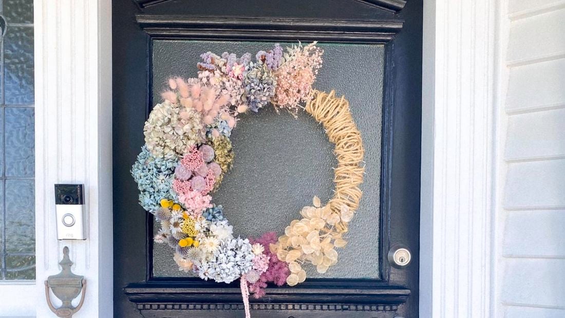 A Christmas wreath on a blue door