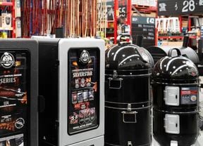 Pit Boss and Matador Catalyst vertical smokers displayed alongside other grilling accessories.