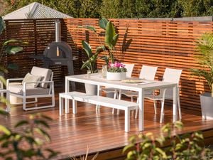 Deck with outdoor dining area and pizza oven 