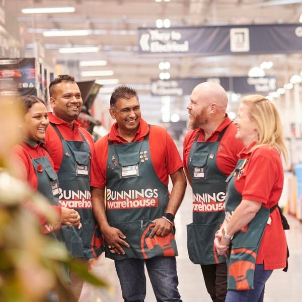 Bunnings team members laughing.