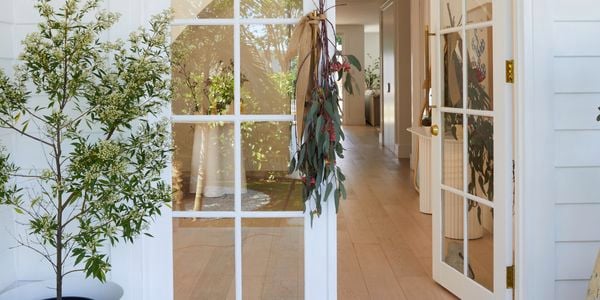 Homemade plant decorations hanging on a front door handle