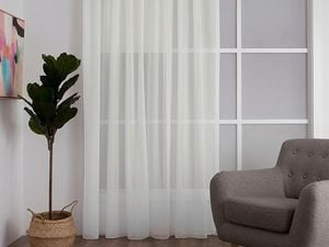 Curtains and armchair in living area