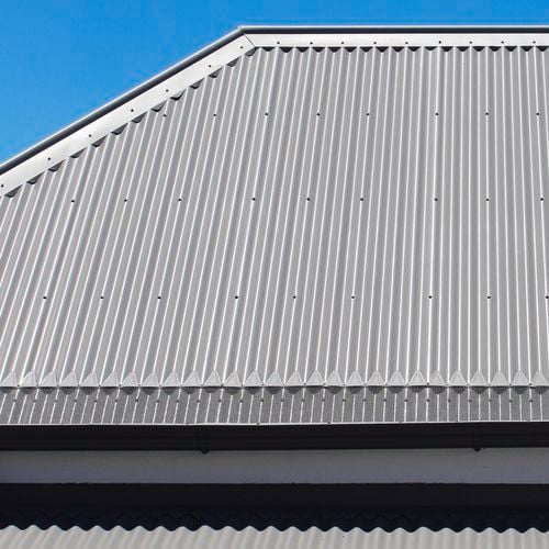 Close up of a roof with an installed gutter mesh.
