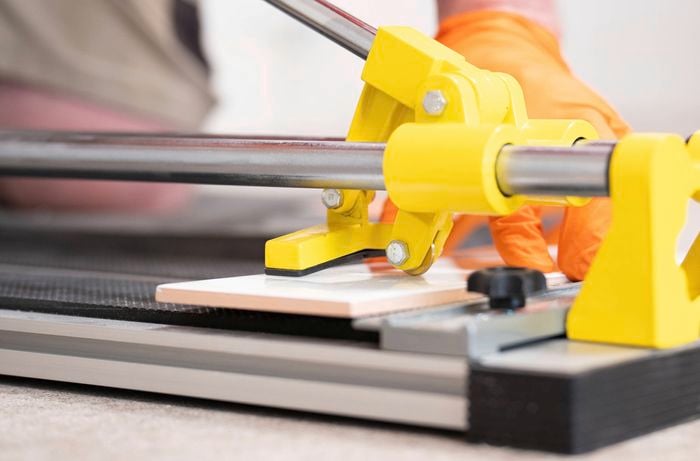 Cut tiles using a tile cutter