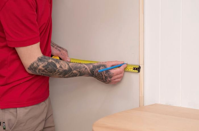 Measure the backset distance where the handle will be installed