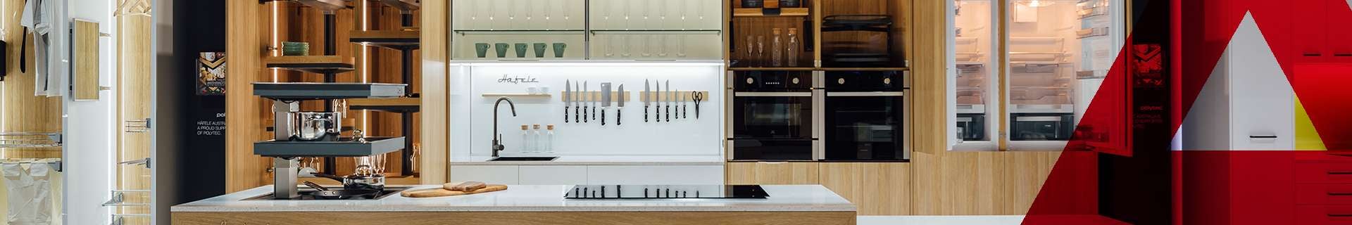 Hafele banner featuring a modern, open plan kitchen.