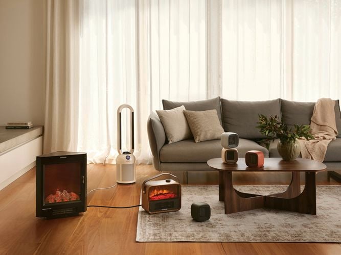 A modern furnished lounge room with timber flooring in it.