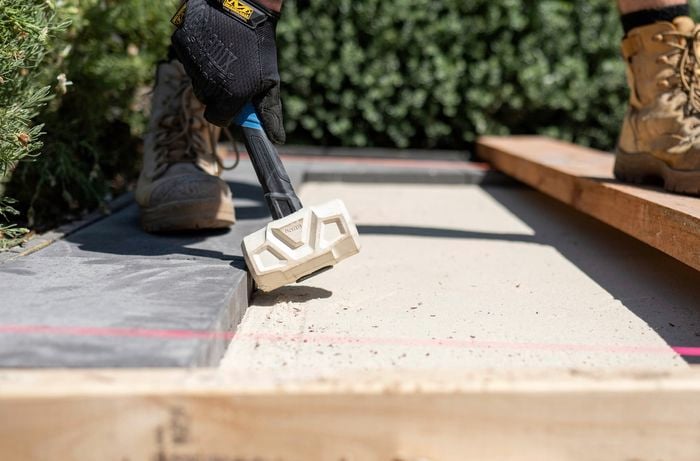 Lay the paver of the second row