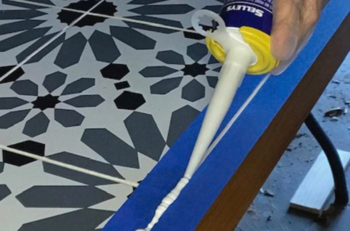 Gap filler applied to the ends of a tiled table
