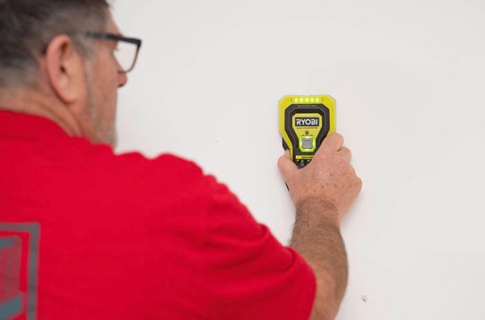 Locate the wall studs with the stud finder
