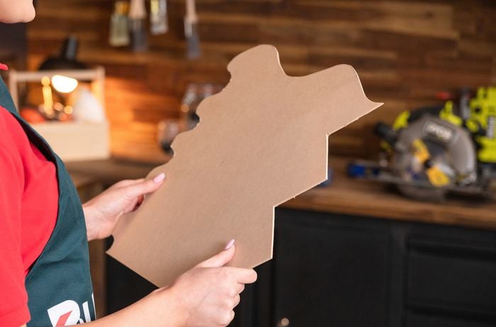 Team Member holding backdrop design template