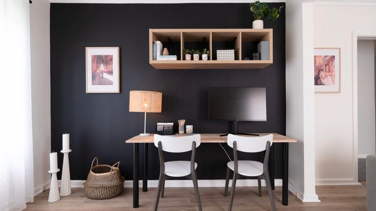 Black feature wall with timber shelving and deck