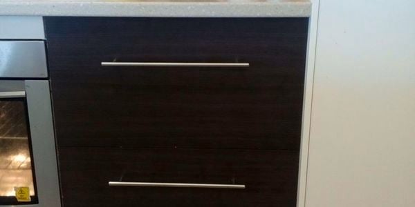 Drawers next to an oven in a kitchen