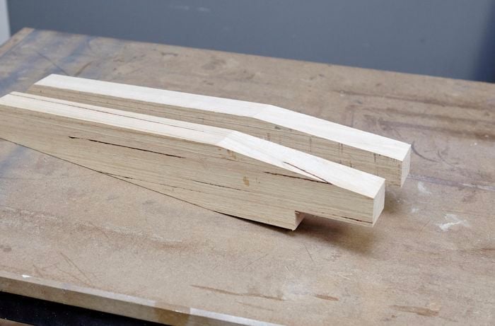 Two finished pieces of timber, tapered at each end to be used as backrests for chairs