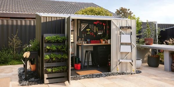 Shed in shot with gardening supplies and tools 
