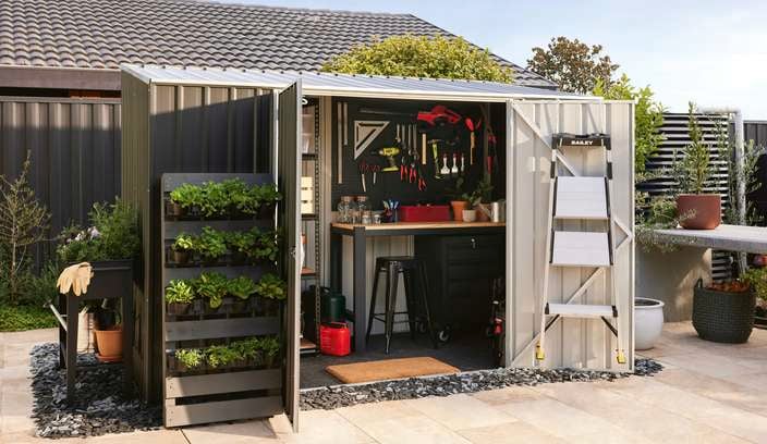 Shed in shot with gardening supplies and tools 
