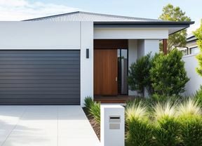Exterior of a modern single-storey home painted in neutral tones, showing how to refresh exterior house paint.