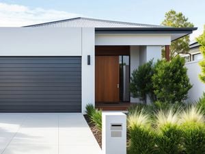 Exterior of a modern single-storey home painted in neutral tones, showing how to refresh exterior house paint.