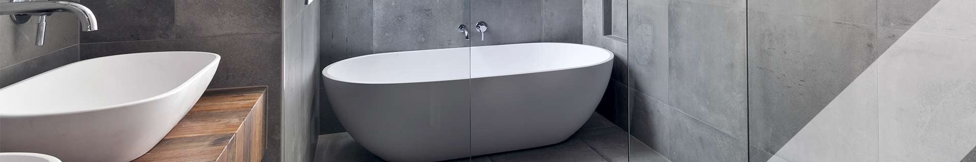 Bathroom with freestanding bath tub, shower and vanity.