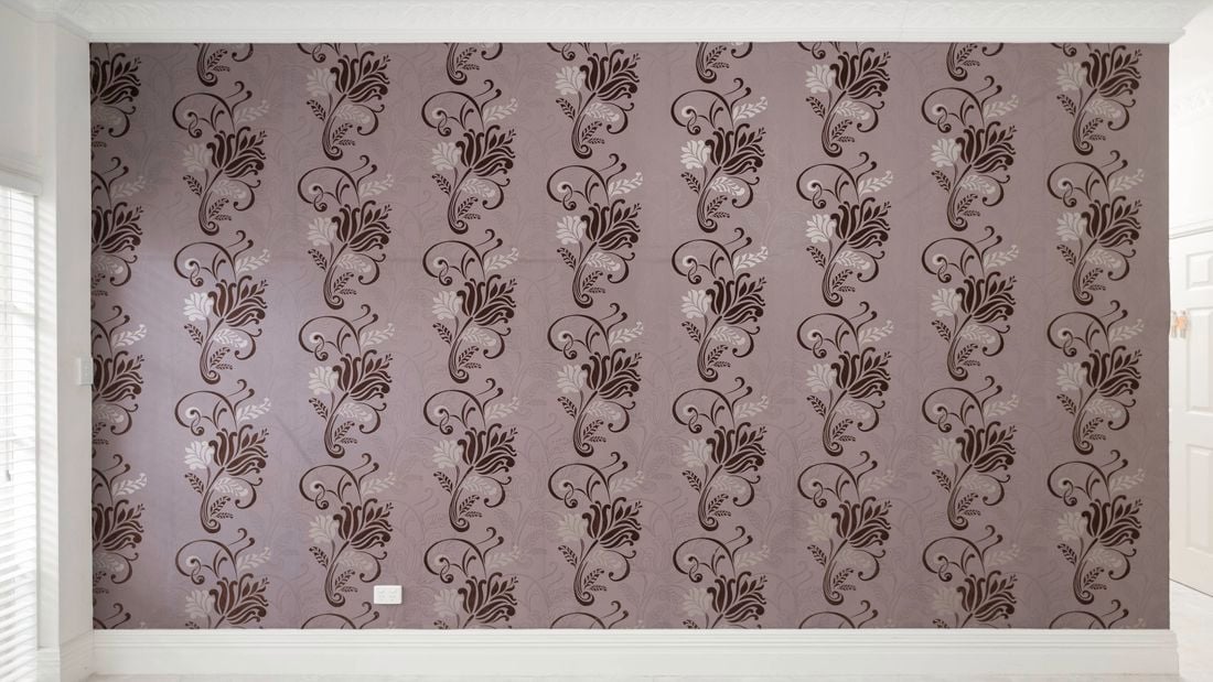 Beautiful wall with cute wallpaper.