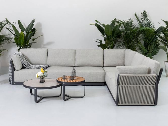 An aluminium outdoor corner lounge setting with side tables