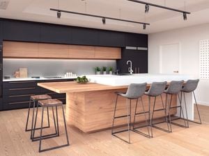 Kitchen Island Island with seats and bench in background with sILVER splashback above