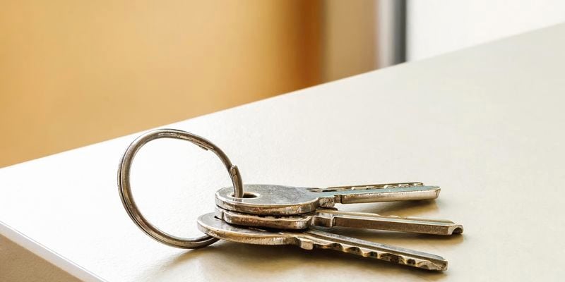 Set of keys sitting on benchtop.
